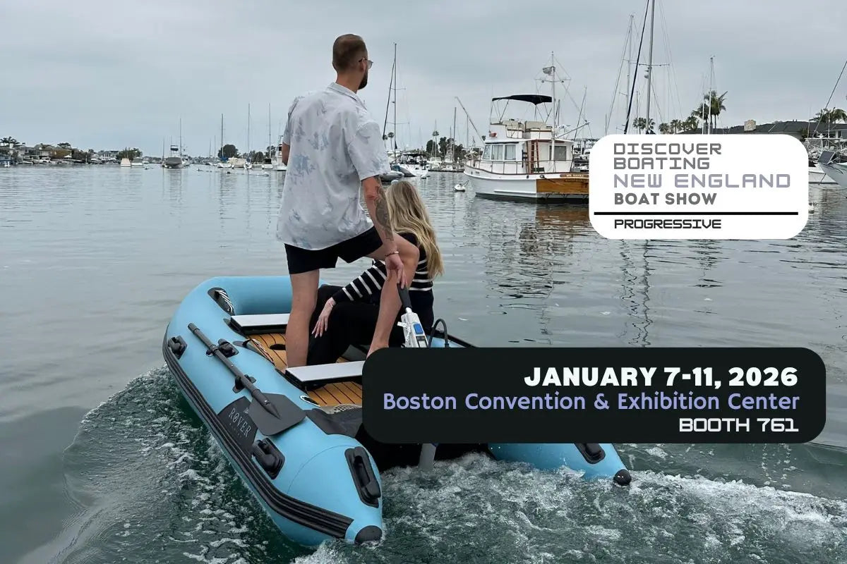 Rover Marine Battle Cat inflatable skiff on the water with two passengers. Text overlay: Discover Boating New England Boat Show, January 7-11, 2026, Boston Convention & Exhibition Center, Booth 761."
