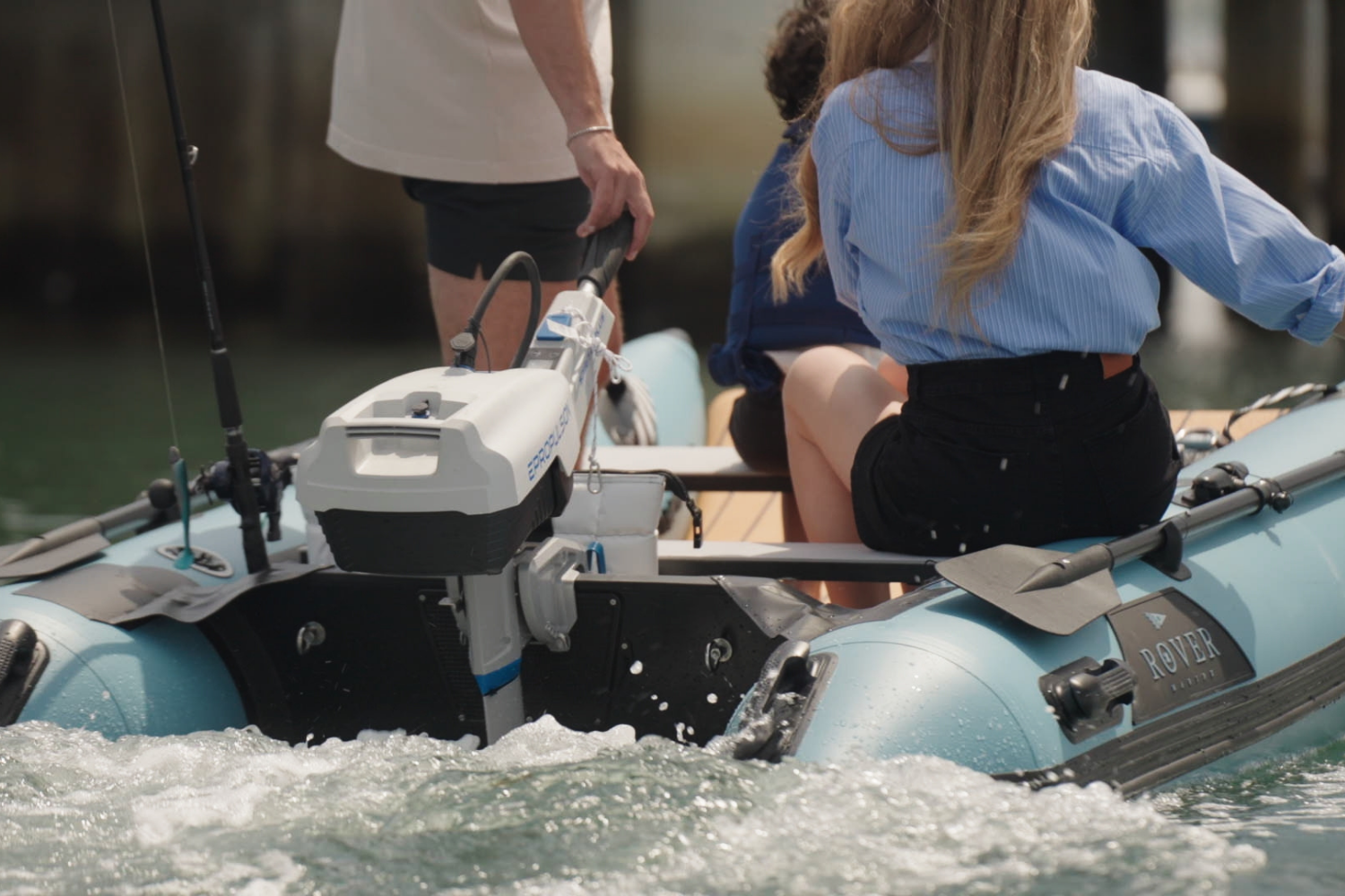 Rear view of Rover Marine inflatable boat with family onboard, powered by an Epropulsion electric motor.
